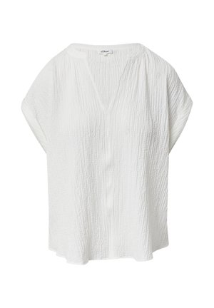 Blouse blanche à manches courtes avec un col en V, fabriquée dans un tissu texturé présentant un motif froissé et une coupe ample. Pas de boutons ni d'ornements visibles.