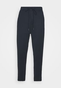 Navyblaue Jogginghose aus weichem Baumwollmix mit elastischem Bund und Kordelzug, schmal zulaufenden Beinen und ohne sichtbare Muster oder Akzente.