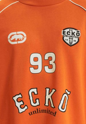 Orange cotton t-shirt featuring a white number "93" and "ECKŌ unlimited" in black and white lettering. Includes a logo with a rhinoceros.