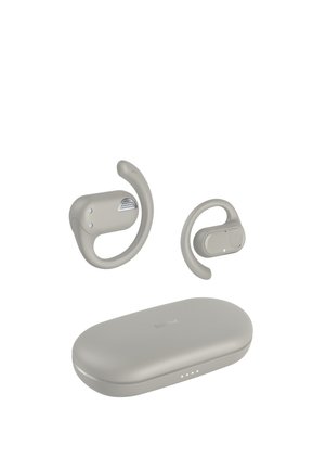 Wireless beige earhooks earbuds with charging case, designed for secure fit during active use.