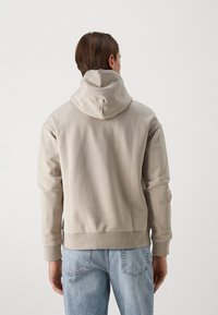 Calvin Klein HERO LOGO COMFORT HOODIE - Sportinis megztinis - atmosphere