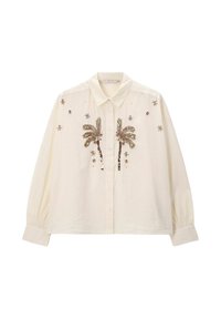 Cream button-up shirt with long sleeves, featuring palm tree embroidery and decorative accents. Fabric appears lightweight and textured.