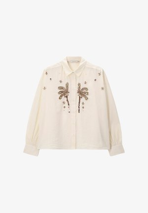 Crèmekleurig overhemd met knopen en lange mouwen, met palmboomborduursel en decoratieve accenten. De stof lijkt lichtgewicht en gestructureerd.
