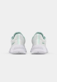 Lightweight athletic shoes in white and mint green, featuring a textured pattern, padded collar, and Reebok logo on the heel.