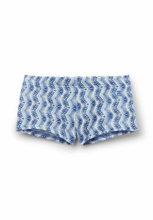 Blå og hvide badeshorts med zigzag-mønster og tætsiddende design, lagt fladt mod en hvid baggrund.