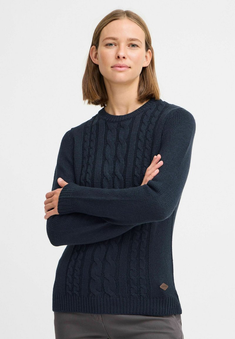 Marineblauer gestrickter Pullover mit einem Zopfmuster, Rippbündchen und Saum. Enthält ein kleines Markenschild in der unteren linken Ecke.