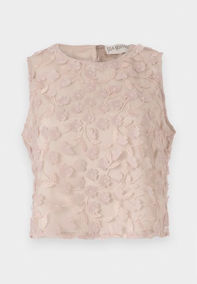 Sleeveless top in light pink, features floral embroidery with raised accents, round neckline, and a back zipper closure. Soft sheer fabric.