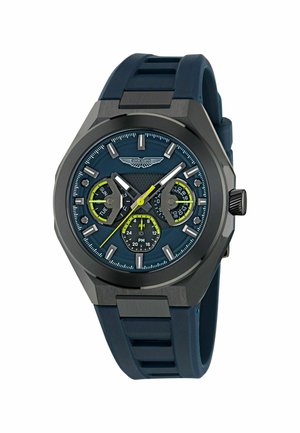 Herrenuhr mit dunkelblauem Silikonarmband, achteckigem Gehäuse und strukturiertem blauem Zifferblatt. Verfügt über gelbe Akzente, Datumsanzeige und drei Hilfszifferblätter.