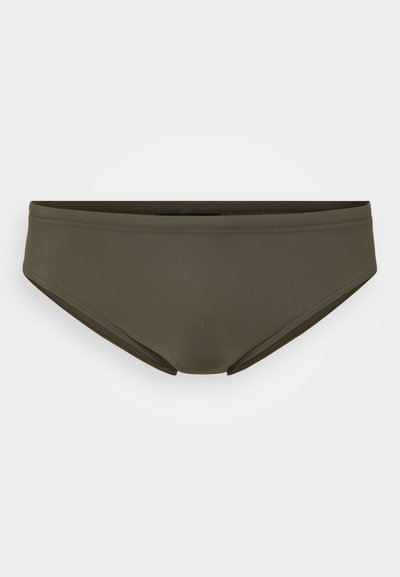 Bas de bikini vert olive avec une texture lisse, doté d'un design taille basse et de coutures minimales. Aucun motif ou matériel supplémentaire visible.
