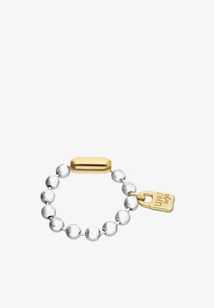 Bracelet à perles argentées avec un fermoir cylindrique en or et une étiquette en or gravée de "UNO de 50".