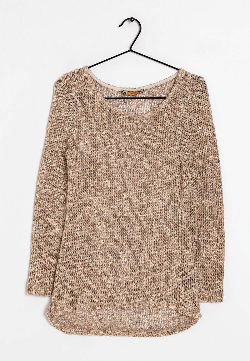 Long-sleeve knitted sweater in beige tones with a loose weave, wide neckline, and extended hem at the back. Hangs from a black hook.