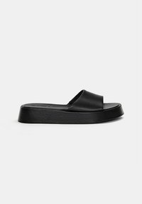 Black platform slide sandal with a wide strap and smooth texture; made of synthetic material, featuring a flat, sturdy sole.