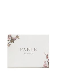 White rectangular box with "FABLE ENGLAND" text and pink floral designs in top left and bottom right corners.