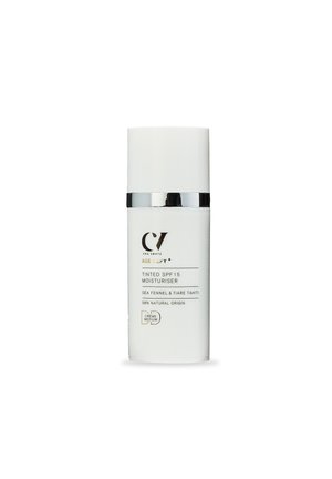 Cha Vøhtz Age Defy+ tinted SPF 15 moisturizer with sea fennel and Tiare Tahiti, 98% natural origin, medium crème in white bottle with silver band.