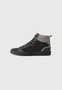 High-top sneaker featuring a black suede and mesh design, grey accents, textured rubber sole, and red "HUGO" logo on the side.