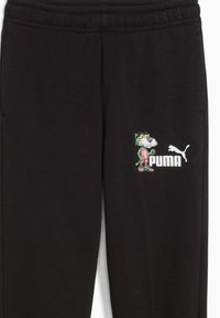 Zwarte sweatpants met een textuurafwerking hebben een kleurrijk cartoonfiguur en het Puma-logo aan de linkerkant. Elastische tailleband bovenaan.