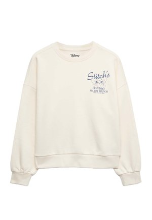 Cremefarbenes Sweatshirt mit langen Ärmeln, mit Stitch-Grafik und dem Text "Stitch's Open Daily All Day Brunch" auf der oberen linken Brust.