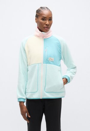 Chaqueta de forro polar en verde menta con detalles en beige y rosa claro. Cuenta con cuello alto, cierre de cremallera y puños acanalados. Detalle de bolsillo delantero.