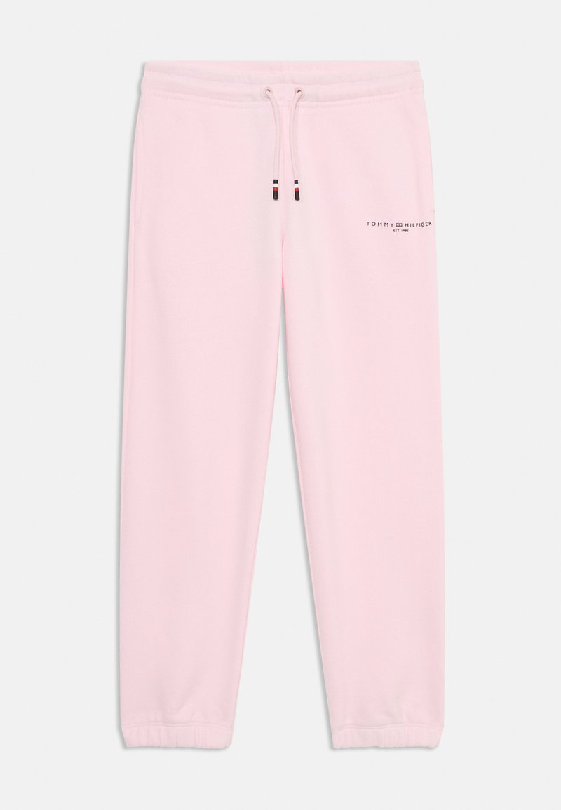 Gaiši rozā treniņbikses, kas izgatavotas no mīksta materiāla, ar elastīgu jostasvietu un aukliņām, kā arī nelielu logo kreisajā kājā.