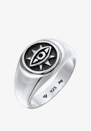 Bague en argent sterling présentant un motif central d'œil noir et argent, entouré d'accents en rayons de soleil, finition lisse et marquée "925 Ag."