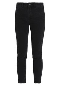 Jeans ajustados de tiro alto en negro, fabricados en denim, con cierre de botón en la parte frontal y bolsillos traseros, con un acabado liso y texturizado.