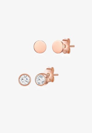 Vaaleanpunakultaiset nappikorvikset sisältävät kaksi muotoilua: yksinkertainen pyöreä levy ja pyöreä malli, jossa on kirkas kivi. Sileä pinta, kiillotettu viimeistely.