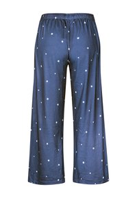 Marina blå pyjamasbyxor med en lös passform, prydda med vita stjärnmönster, elastisk midja och en smidig, lätt tygtextur.