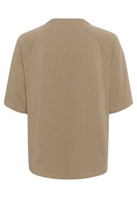 Camiseta de manga corta, color beige, con escote redondo y mangas raglán, que presenta una textura suave y un corte relajado.