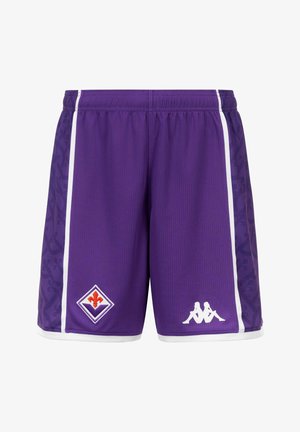 Shorts de sport violets avec des bandes blanches sur les côtés, un logo fleur-de-lis rouge et blanc sur la jambe gauche et un logo blanc représentant une silhouette assise sur la jambe droite.