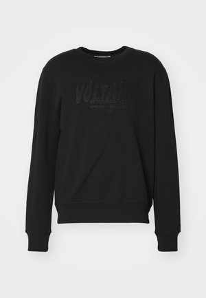 Sort sweatshirt med rund halsudskæring, lange ærmer og tekstureret logo detalje på forsiden. Materialet ser blødt ud og har et afslappet design.