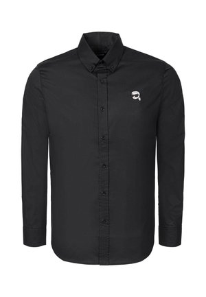 Black long-sleeve button-up shirt with a buttoned collar and a small white logo featuring a stylized face with sunglasses on the chest.