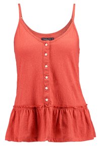 Korallfärgad ärmlös tanktop med knappar framtill och volangkant, med rundad halsringning och tunna axelremmar.
