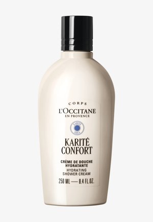 Crema doccia idratante Karité Confort di L'Occitane, flacone bianco da 250 ml con tappo nero e etichetta con testo in francese e inglese.