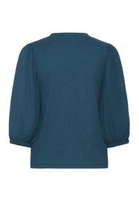 Blouse texturée bleu sarcelle avec encolure ronde et manches bouffantes à poignets élastiques. Tissu lisse de couleur unie, vue arrière montrée.
