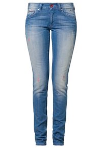 Smala blå denimjeans med en blekt finish, slitna detaljer och subtila slitningar. Har knäppning med knapp och fem fickor.