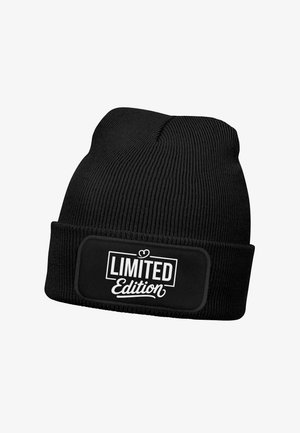 Black knit beanie with a fold-over cuff. Features a rectangular patch with white "LIMITED Edition" text. Ribbed texture throughout.