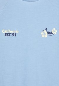 Light blue fabric with text "California EST. '91" and floral design with "USA" in dark and light colors.