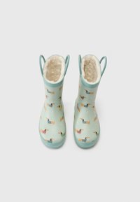 Botas de goma impermeables de color azul claro con un suave forro beige, que presentan patrones coloridos de teckels y dos asas para facilitar su puesta.