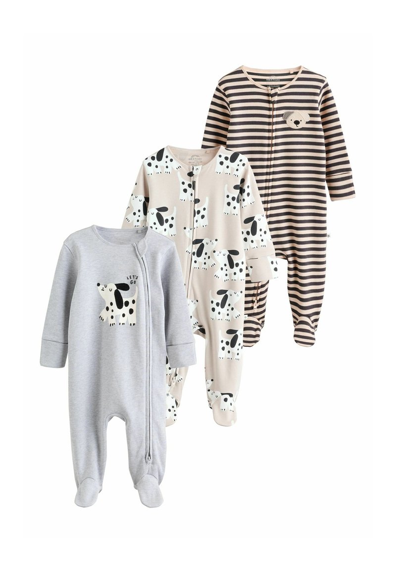 Three baby pajamas in various designs: a gray one with a dog print, a cream with black dog patterns, and a striped brown one with an accent.