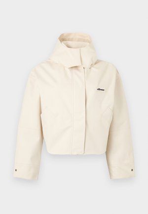 Chaqueta corta de color crema con cuello alto, mangas largas, puños con botones a presión y pequeño logo de ellesse en el pecho izquierdo.