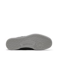 Black athletic shoe featuring a gray rubber outsole with a diamond tread pattern and Reebok branding in the midsole.