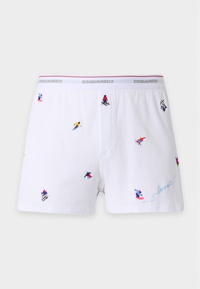 Boxers blancs avec des skieurs et snowboardeurs colorés brodés, ceinture élastique avec le logo "DSQUARED2" en lettres grises.