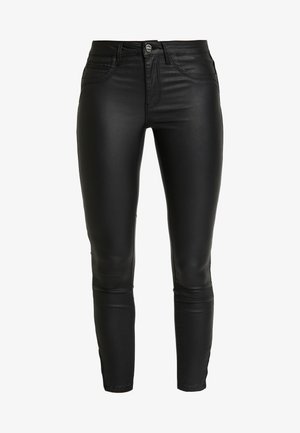 Must värvilised faux nahast kitsad püksid, millel on sile tekstuur, kõrge vöökoht ja traditsiooniline viie tasku disain. Omab esimest lukku ja metallist nuppu.