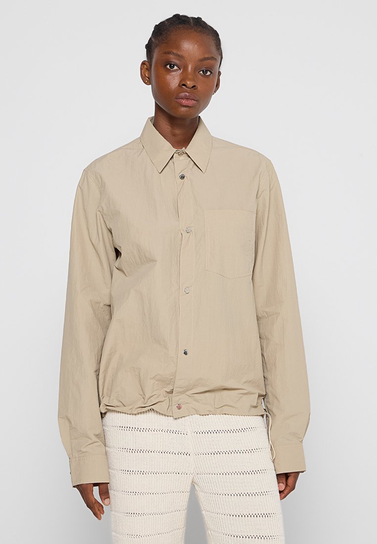 Nanushka Overhemdblouse beige Nanushka Overhemdblouse beige