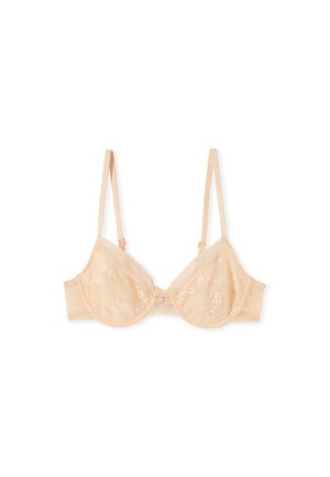 Reggiseno beige in pizzo con ferretto, spalline sottili regolabili e piccolo fiocco centrale, disteso su uno sfondo bianco.