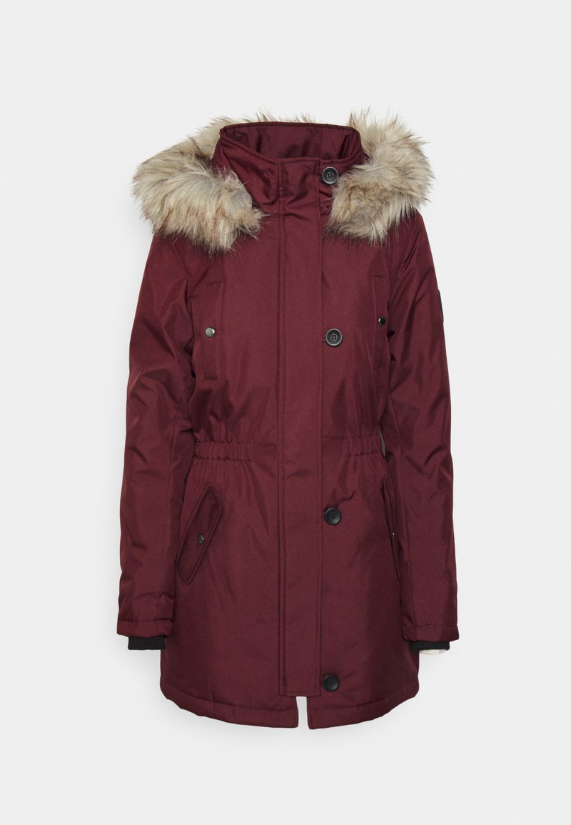 Parka bordeaux avec capuche en fausse fourrure, dotée d'une fermeture éclair et de boutons, d'une taille élastique et de deux poches latérales. Texture lisse et léger.