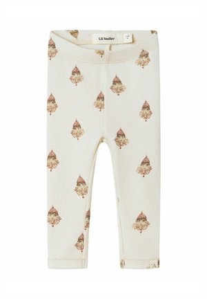 Crème peuterleggingen met een ribbelstructuur, met een herhalend patroon van kleine vintage-stijl clowngezichten die een rode hoed dragen.