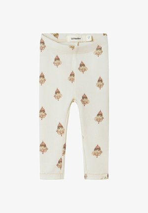 Crème peuterleggingen met een ribbelstructuur, met een herhalend patroon van kleine vintage-stijl clowngezichten die een rode hoed dragen.