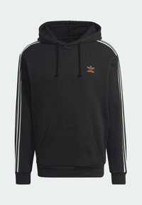 Svart hoodie i bomull, med vita sidostråk, en framsida med känguruficka och en broderad logotyp i orange och vitt.