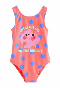 Korallivärviline ühes tükis ujumistrikoo siniste täppidega, millel on konksukujuline graafika naeratava näo ja tekstiga "Kas läheme randa?"